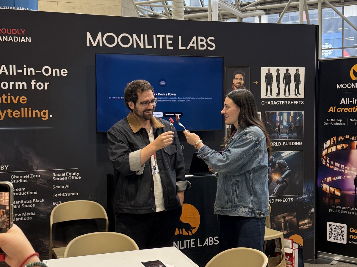 Film Picnic interviewing Adam Fainman at the Moonlite Labs booth with spoon and fork microphones