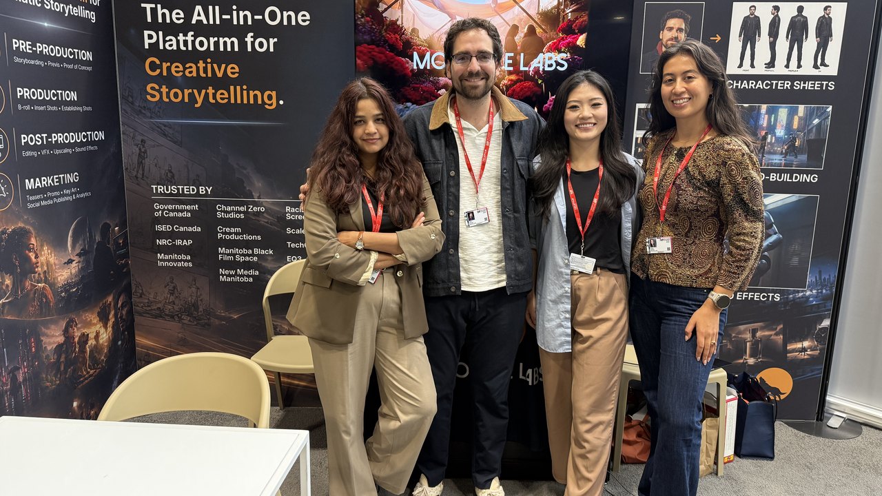 The Moonlite Labs team, four people wearing TIFF: The Market lanyards, standing in front of the Moonlite Labs booth wall that reads The All-in-One Platform for Creative Storytelling
